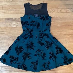 Green dress with black floral detail